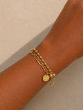 ✨ Bracelet doré multi-chaînes avecperles et pampilles – Élégance moderne et raffinée • Orlina ✨
